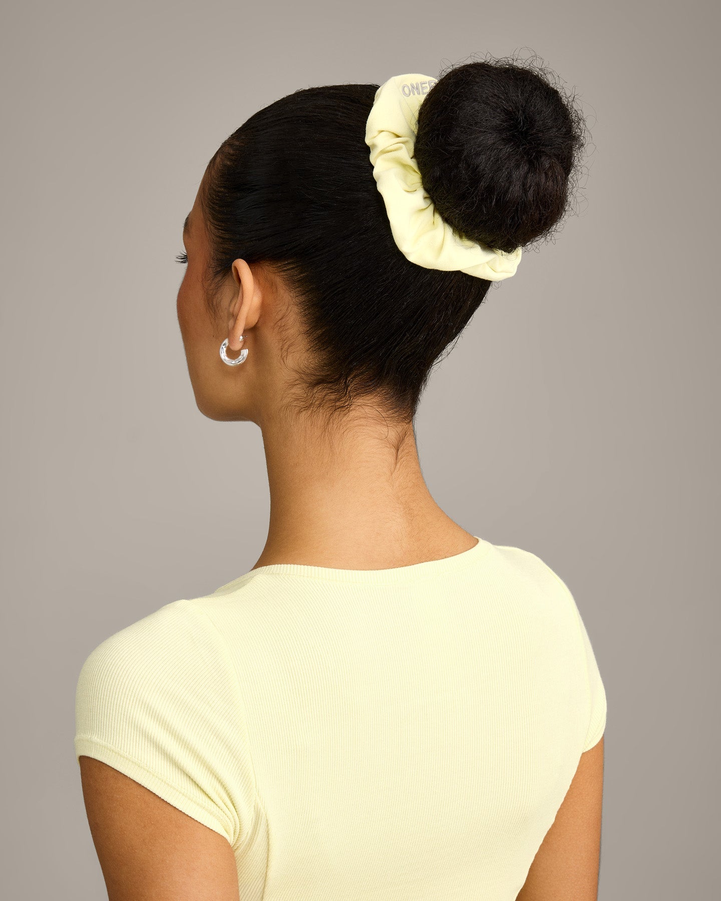 SoftMotion™ Scrunchie with Gray Logo | Pastel Yellow
