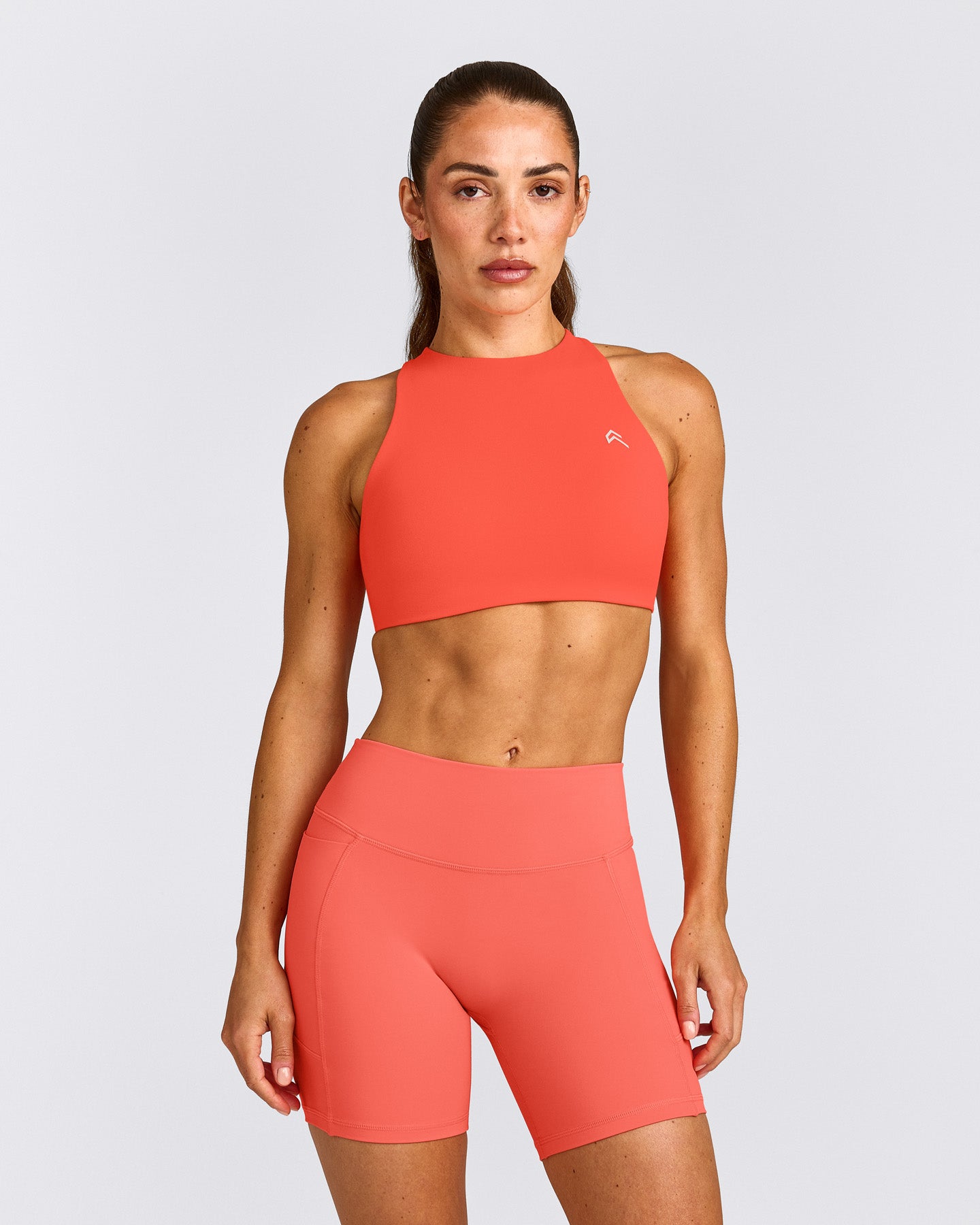 EasyLift™ High Neck Sports Bra with Gray Logo | Hyper Orange