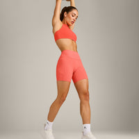 EasyLift™ High Neck Sports Bra with Gray Logo | Hyper Orange