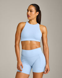 EasyLift™ High Neck Sports Bra with Gray Logo | Powdered Blue