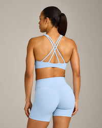 EasyLift™ High Neck Sports Bra with Gray Logo | Powdered Blue