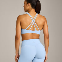 EasyLift™ High Neck Sports Bra with Gray Logo | Powdered Blue