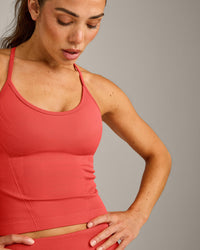 EnhanceLift™ Seamless Strappy Racer Tank Top with Built in Bra Shelf with Gray Logo | Dark Charged Coral