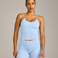 EnhanceLift™ Seamless Strappy Racer Tank Top with Built in Bra Shelf with Gray Logo | Powdered Blue