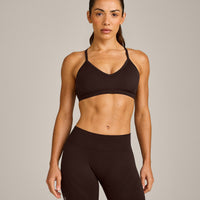 EnhanceLift™ Seamless Strappy Sports Bra with Gray Logo | 70% Cocoa