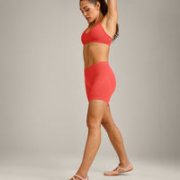 EnhanceLift™ Seamless Strappy Sports Bra with Gray Logo | Dark Charged Coral