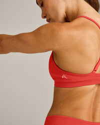 EnhanceLift™ Seamless Strappy Sports Bra with Gray Logo | Dark Charged Coral