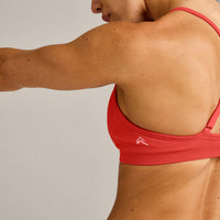 EnhanceLift™ Seamless Strappy Sports Bra with Gray Logo | Dark Charged Coral