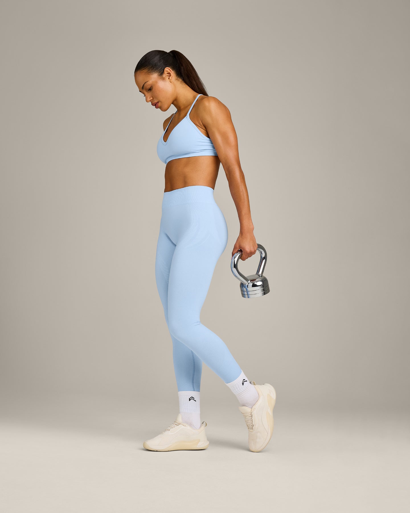 EnhanceLift™ Seamless Strappy Sports Bra with Gray Logo | Powdered Blue