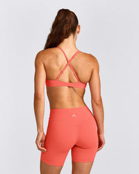 UnifiedMove™ Cross Back Sports Bra with Reflective Logo | Light Charged Coral
