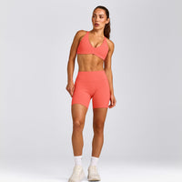 UnifiedMove™ Cross Back Sports Bra with Reflective Logo | Light Charged Coral