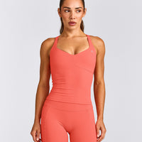 UnifiedMove™ T Back Mid Tank Top with Built in Bra Shelf with Reflective Logo | Light Charged Coral