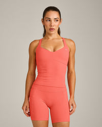 UnifiedMove™ T Back Mid Tank Top with Built in Bra Shelf with Reflective Logo | Light Charged Coral