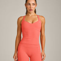 UnifiedMove™ T Back Mid Tank Top with Built in Bra Shelf with Reflective Logo | Light Charged Coral