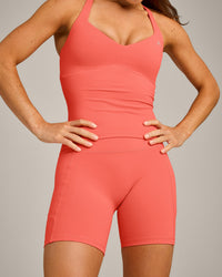 UnifiedMove™ T Back Mid Tank Top with Built in Bra Shelf with Reflective Logo | Light Charged Coral
