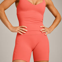 UnifiedMove™ T Back Mid Tank Top with Built in Bra Shelf with Reflective Logo | Light Charged Coral