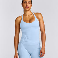 UnifiedMove™ T Back Mid Tank Top with Built in Bra Shelf with Reflective Logo | Powdered Blue