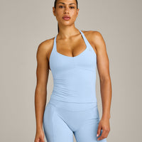 UnifiedMove™ T Back Mid Tank Top with Built in Bra Shelf with Reflective Logo | Powdered Blue