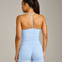 UnifiedMove™ T Back Mid Tank Top with Built in Bra Shelf with Reflective Logo | Powdered Blue