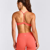 UnifiedMove™ T Back Minimal Bralette with Reflective Logo | Light Charged Coral