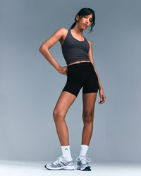 SoftMotion™ Racer Back Mid Tank Top with Built in Bra Shelf with Gray Logo | Coal