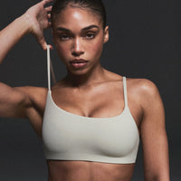 SoftMotion™ Strappy Sports Bra with Gray Logo | Oatmeal