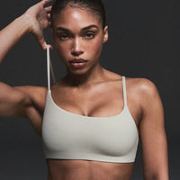 SoftMotion™ Strappy Sports Bra with Gray Logo | Oatmeal
