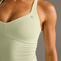 UnifiedMove™ T Back Mid Tank Top with Built in Bra Shelf New Branding | Meadow Mist Green