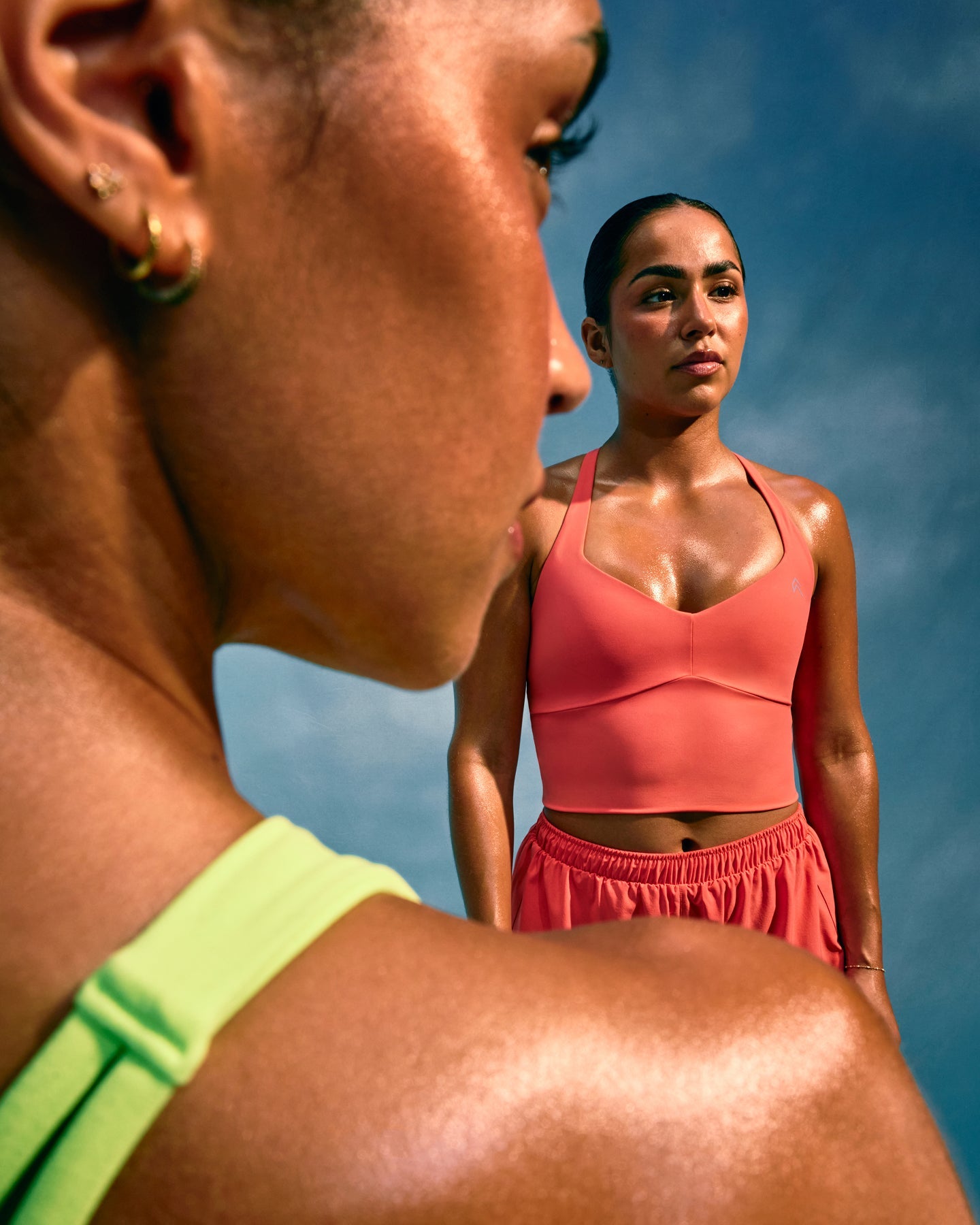 UnifiedMove™ T Back Mid Tank Top with Built in Bra Shelf with Reflective Logo | Light Charged Coral
