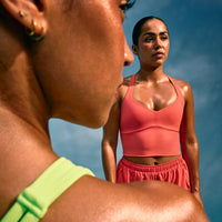 UnifiedMove™ T Back Mid Tank Top with Built in Bra Shelf with Reflective Logo | Light Charged Coral