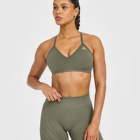 EnhanceLift™ Seamless Strappy Sports Bra with White Logo | Alpine Green