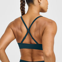 EnhanceLift™ Seamless Strappy Sports Bra with White Logo | Washed Oil Blue