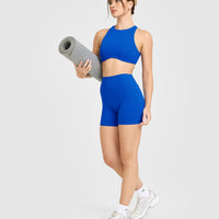 SoftMotion™ High Neck Sports Bra with White Logo | Light Cobalt Blue