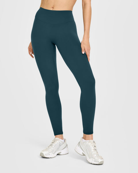 SoftMotion™ High Waisted Leggings with White Logo in Oil Blue