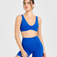SoftMotion™ Scoop Back Bralette with White Logo | Light Cobalt Blue