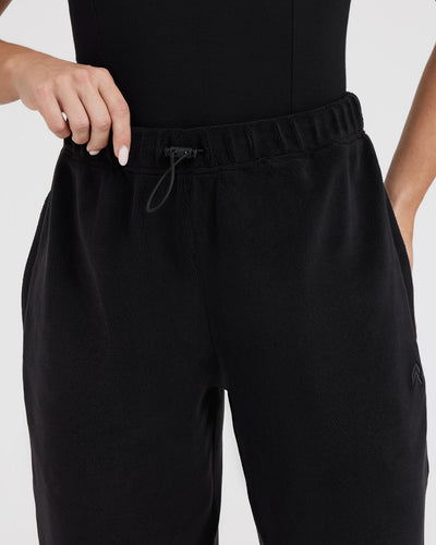 The high-waisted, elasticated Cuffed Black Fleece Oversized Jogger with ...