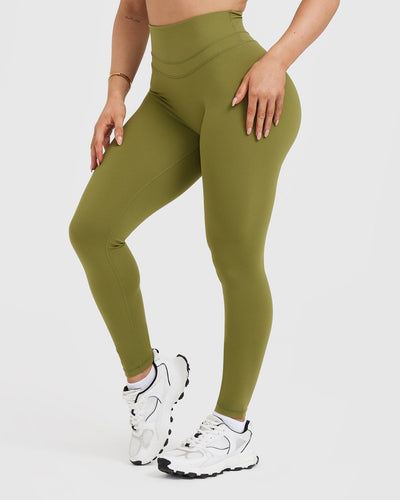 https://us.oneractive.com/cdn/shop/products/UNIFIED_HIGH_WAISTED_LEGGING_OLIVE_OIL_GREEN_03_400x.jpg?v=1707213353